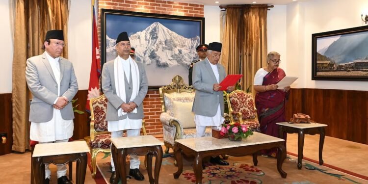 Nepal’s President Paudel administers the oath of office to Sushila Karki, a former Chief Justice, as Nepal’s interim PM during a swearing-in ceremony.